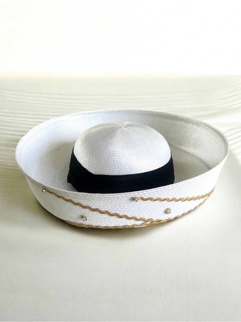 Elegant White Hat with Black Band and Gold Trim